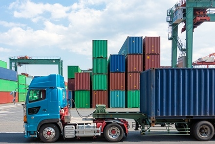 Truck with shipping containers