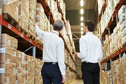 Two managers in a warehouse