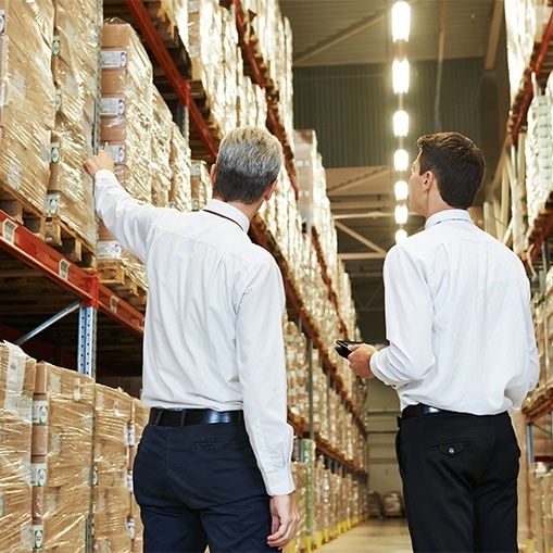 Two managers in a warehouse